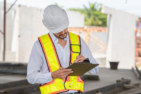 Engineer man planning project in the factory site, Foreman worker working at construction site