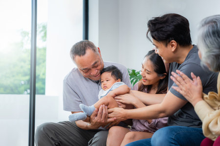 Happy Grandparents with Son, Daughter-in-law, and Grandchild, Family Bonding and Love on the Couch,...