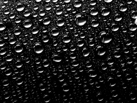 Water drops on a black background. Abstract beautiful background.の写真素材