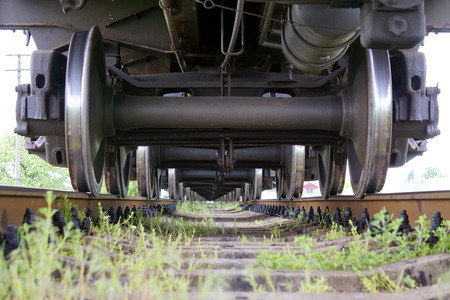 The wheels of the diesel locomotive on the rails. Railway transport.の写真素材