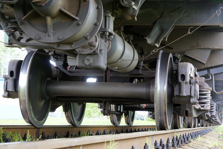 The wheels of the diesel locomotive on the rails. Railway transport.の写真素材