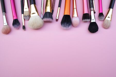 Tools of women beauty fashion cosmetic brush products for facial.Top view,flat lay on the pastel pink background.copy space for textの写真素材