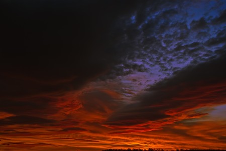 the dark red sunrise background with cloudsの写真素材