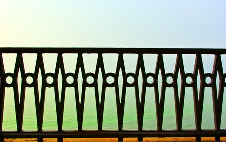 the beautiful forged fence against the sea
