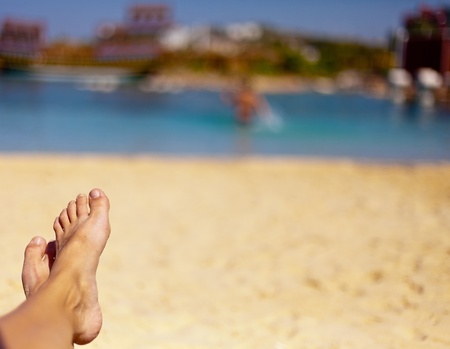 the sandy feet on the beautiful beach
