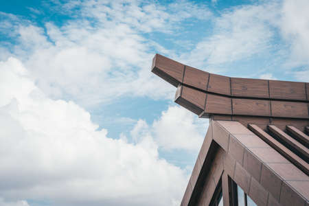 Modern architecture with blue sky and white clouds.の写真素材