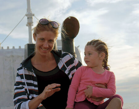  	
 	
Russia, Azov sea, 18.06.2014, mother, daughter 3 years smiling at sea-the white boat                  のeditorial素材