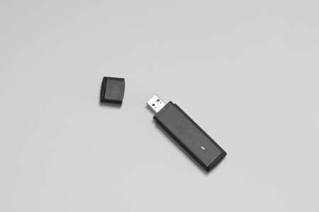 A black USB internet stick on a white backroundの写真素材