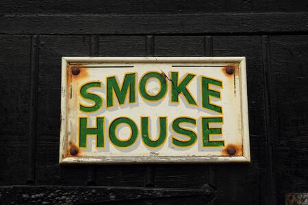 Old smoke house signの写真素材