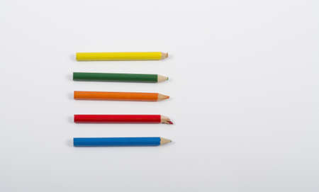 Used crayons isolated on a white backgroundの写真素材
