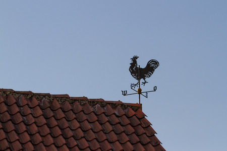 Weathercock on the roofの写真素材