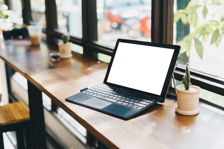 Laptop with blank screen on table,Laptop on desk,Business Work place and concept,Technology concept,Selective focus.の写真素材