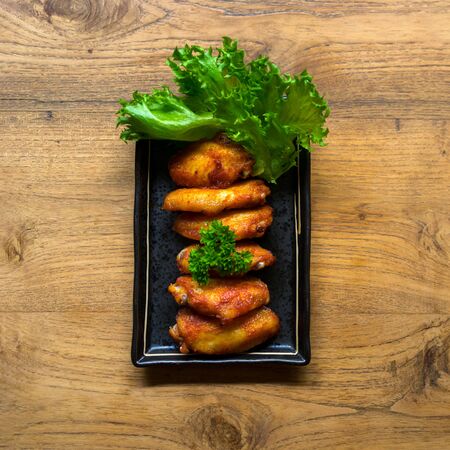 fried chicken wing bbq,homemade cooking with chicken meat,top view on tableの写真素材