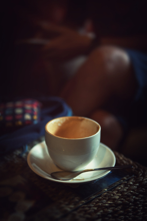 empty coffee mug on wood table.morning refreshment beverage.の写真素材