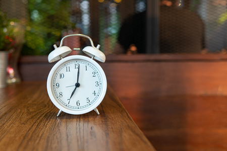 Vintage Clock on wooden table.の写真素材