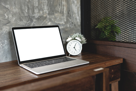 Blank screen laptop on table template.Laptop computer white screen for insert UI (User Interface) design mock up.の写真素材