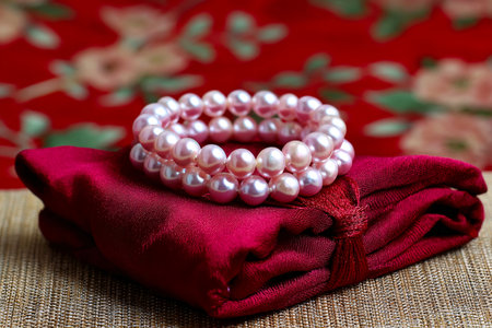 artisan hand knotting pearl bracelet, jewelry craftsmanship, process focused imageの素材
