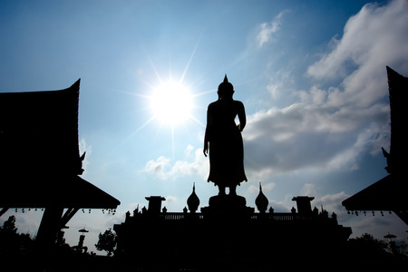 Silhouette big buddha statue in sunset background.の写真素材