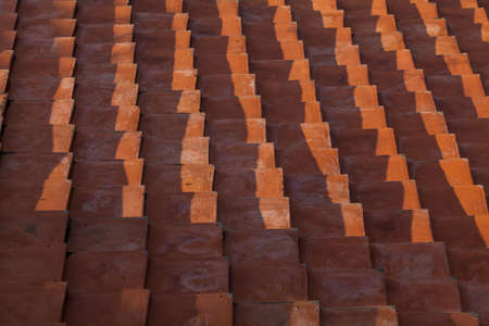 Orange tiles placed arranged as background.の写真素材