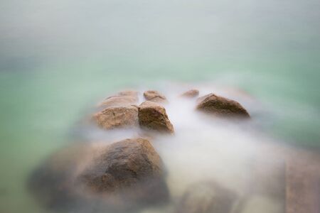 Seaside with many rock, long exposure shot.の写真素材