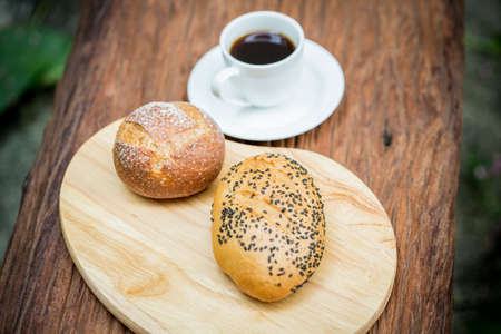 Cup of hot coffee with bake bread for breakfastの写真素材