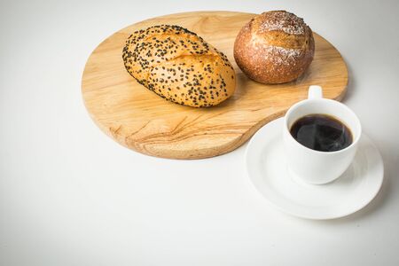 Cup of hot coffee with bake bread for breakfastの写真素材