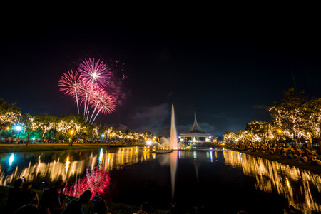 Monument in public park of thailand and festival fireworks in public parkの写真素材