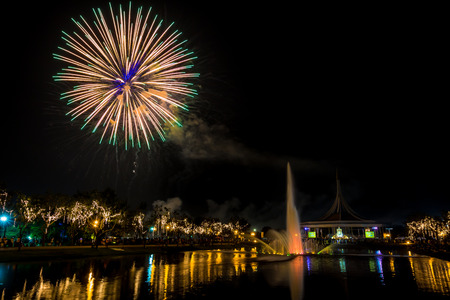 Monument in public park of thailand and festival fireworks in public parkの写真素材