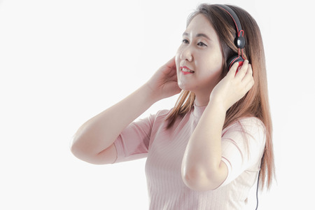 Asian girls are relaxing by listening to music.