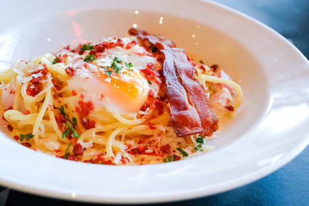 Spaghetti Carbonara with egg ,Bacon Ham Parsley and Mayonnaise Sauce.の写真素材