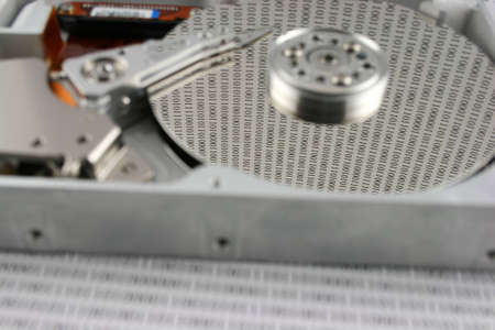 An open Hard disk with binary numbers on the platter  shallow  DOF