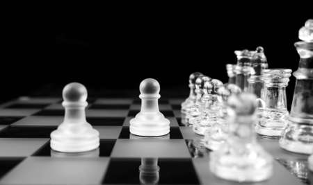 Glass Chess Pieces on a Frosted Glass Chess Boardの写真素材