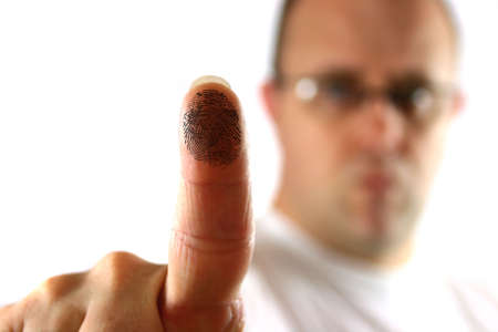 Man activating a biometric area using his fingerの写真素材