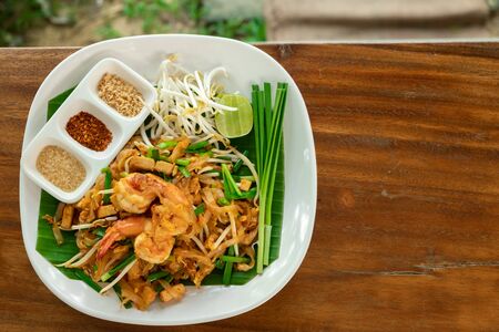 Pad Thai Asian food with copy space.Thai traditional noodle stir fry with prawn over banana leaf.の写真素材