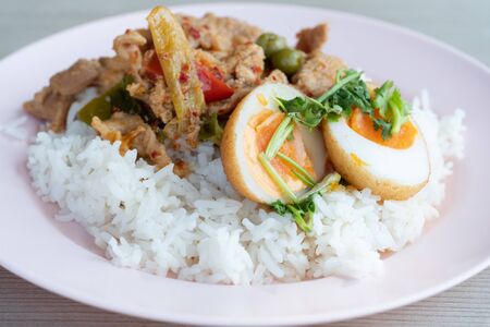 Asian curry with rice food with copy space.Boiled egg on top of Thai traditional cuisine.の写真素材