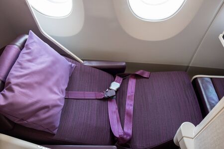 Flat bed Business class travel seat of an airline when fly with an airplane.Luxury and comfort journey.の写真素材