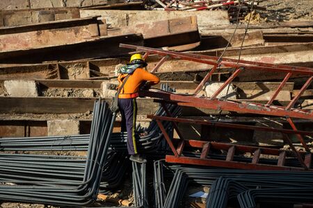 A construction worker do a job such as painting welding in a construction site.