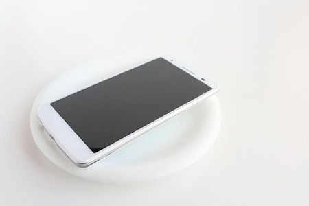 A dish and smartphoneの写真素材