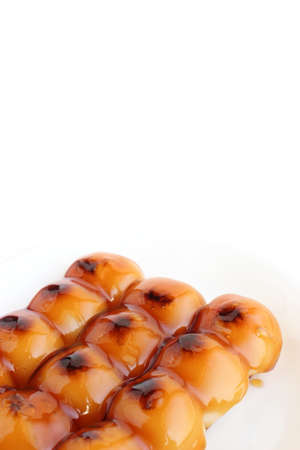 rice dumpling in a sweet soy sauce isolated on whiteの写真素材