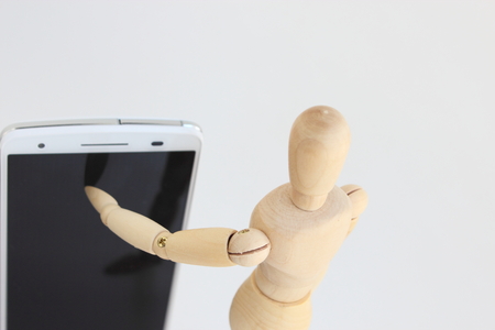 Drawing doll's smartphone operationの写真素材