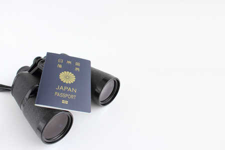 Binoculars and passportの写真素材