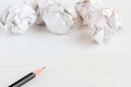 Pencil and note and paper ballの写真素材