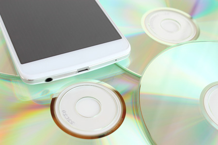 Smartphone and diskの写真素材