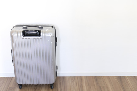 Indoor silver suitcaseの写真素材