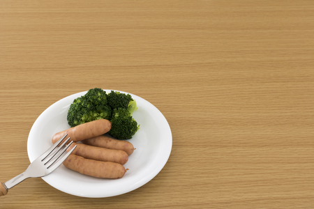 Served sausage and broccoliの写真素材
