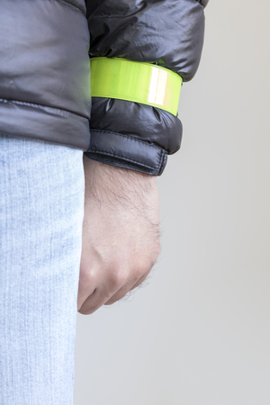Man's arm with a reflective wristband