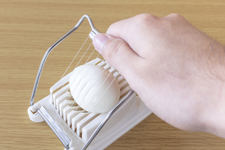 Image of using egg slicerの写真素材