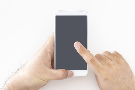 Male hand operating a smartphone