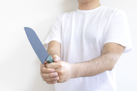 Man holding a kitchen knifeの写真素材