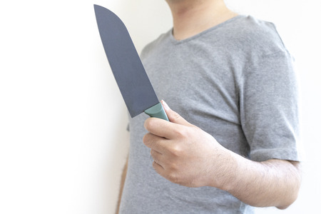 Man holding a kitchen knifeの写真素材